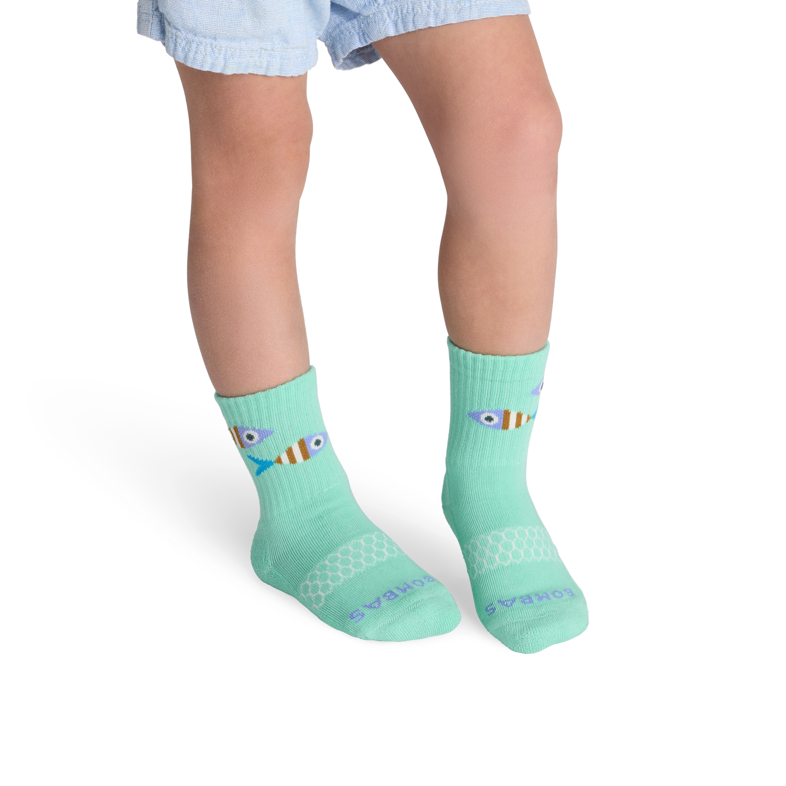 official-bombas::10462-caymangreen-junior-unisex-onmodel-2-transparent.png