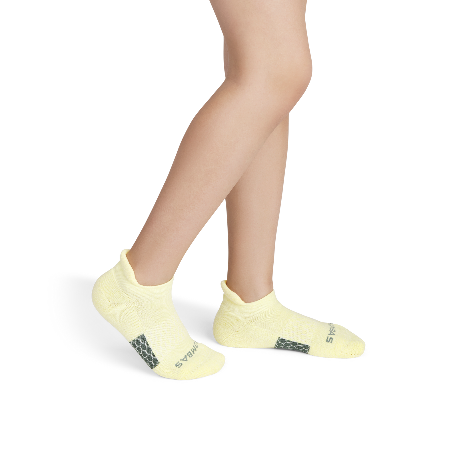official-bombas::6973-glow-softwhite-youth-unisex-onmodel-2-transparent.png