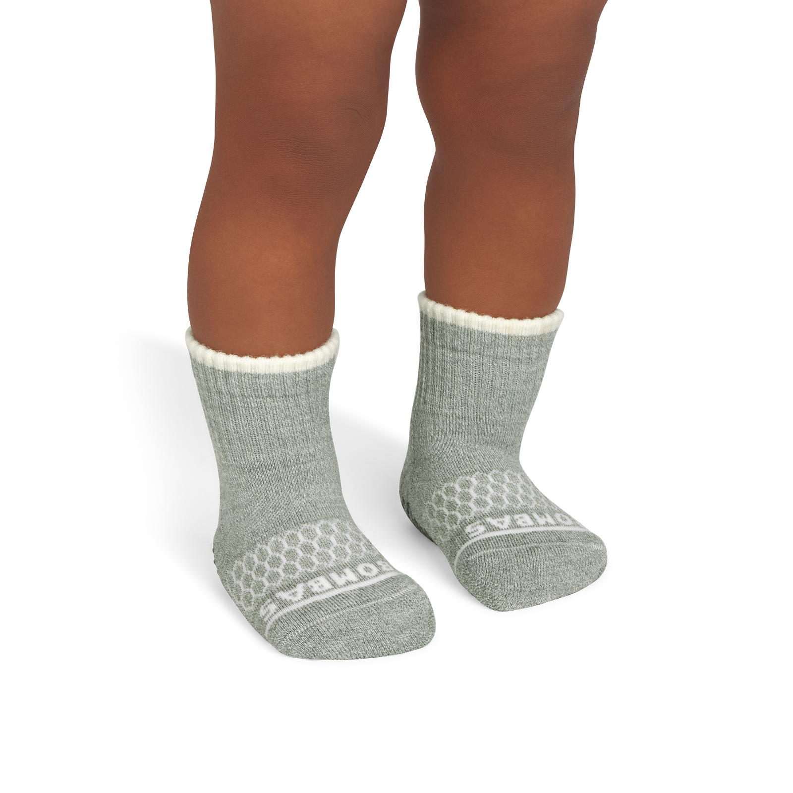 official-bombas::7106-sagehaze-softwhite-toddler-unisex-onmodel-2-transparent.png