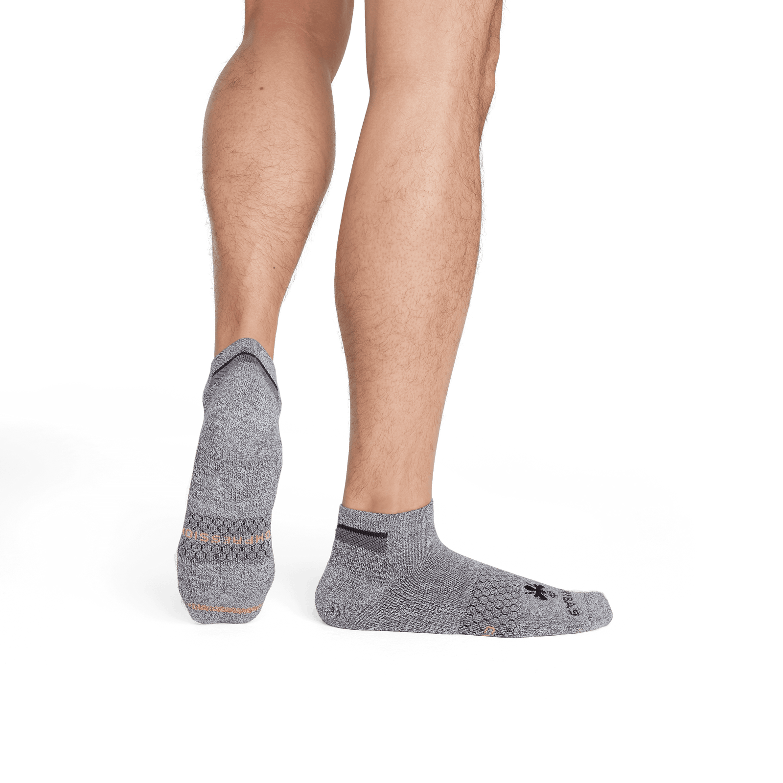 official-bombas::7672-charcoal-neonorange-adult-male-3-transparent.png
